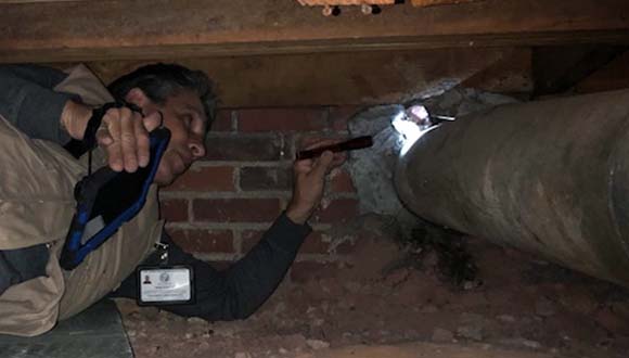 Michael Vincent Gage, licensed home inspector in Fletcher NC, checking a crawlspace as part of a professional home inspection.